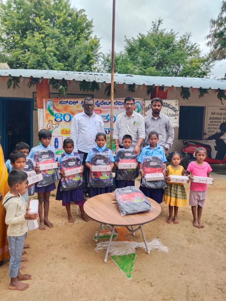 Sunvik Steels school bag distribution at a government school in Sira taluk